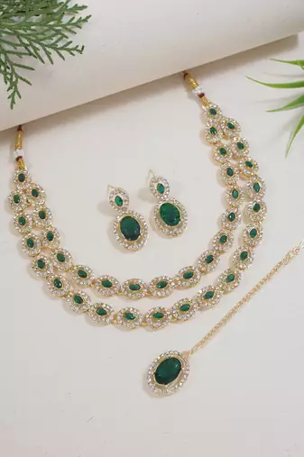 Gold plated stylish design crystal diamond oval shape necklace with earrings & maang tikka jewellery