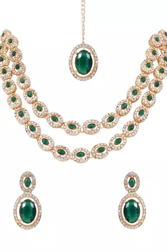 Gold plated stylish design crystal diamond oval shape necklace with earrings & maang tikka jewellery