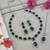 Silver plated stylish design crystal diamond necklace with earrings & maang tikka jewellery set for women (green)