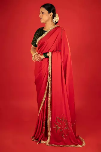 Red embroidered satin saree