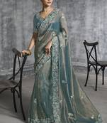Turquoise silk embroidered wedding wear saree