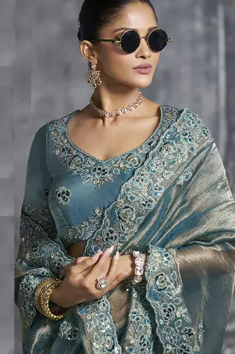 Turquoise silk embroidered wedding wear saree