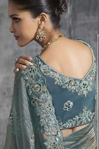 Turquoise silk embroidered wedding wear saree