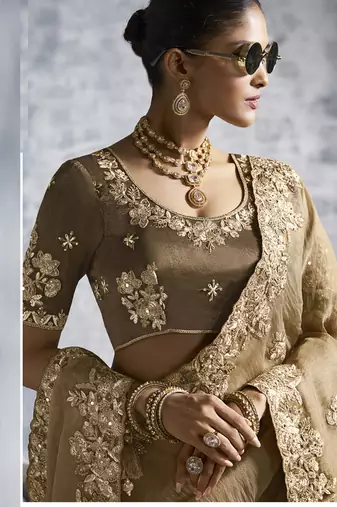Beige silk embroidered wedding wear saree