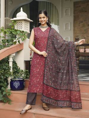 Women maroon rayon blend floral printed straight kurta trousers with dupatta 3