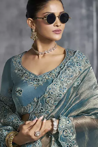 Teal blue tissue saree with embroidered work