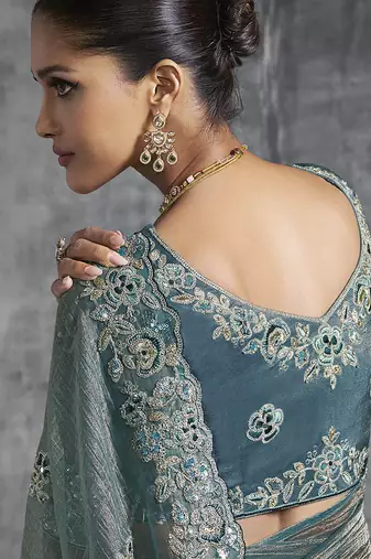 Teal blue tissue saree with embroidered work