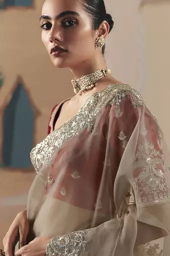 Embroidered beige fancy fabric saree