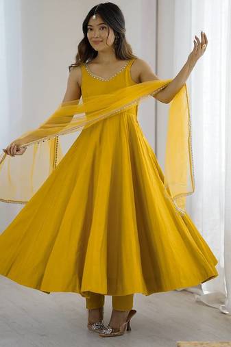Yellow roman silk chanderi anarkali with fancy lace work, 4 mtr flair, stitched pant and net dupatta set