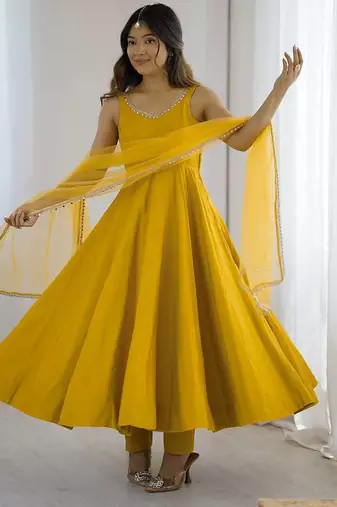 Yellow roman silk chanderi anarkali with fancy lace work, 4 mtr flair, stitched pant and net dupatta set