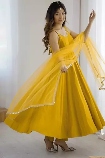 Yellow roman silk chanderi anarkali with fancy lace work, 4 mtr flair, stitched pant and net dupatta set