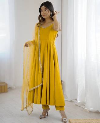 Yellow roman silk chanderi anarkali with fancy lace work, 4 mtr flair, stitched pant and net dupatta set 6