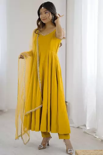 Yellow roman silk chanderi anarkali with fancy lace work, 4 mtr flair, stitched pant and net dupatta set