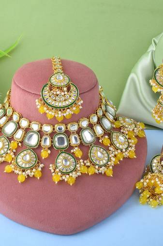 Bright yellow color kundan necklace set with royal indian design