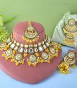 Bright yellow color kundan necklace set with royal indian design