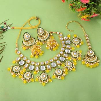 Bright yellow color kundan necklace set with royal indian design 2