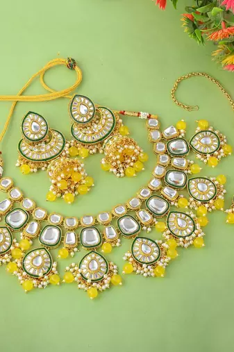 Bright yellow color kundan necklace set with royal indian design