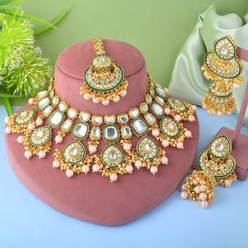 Designer gold color kundan necklace set for exclusive bridal look 1