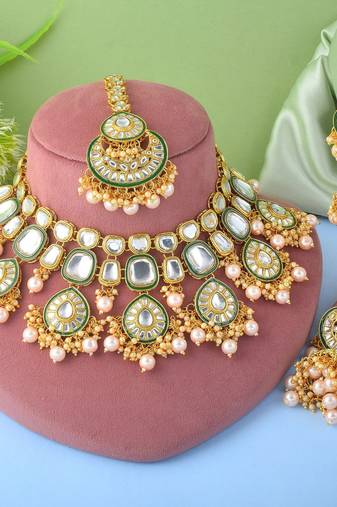 Designer gold color kundan necklace set for exclusive bridal look