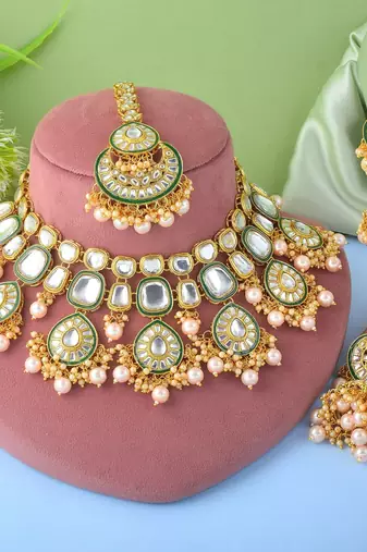 Designer gold color kundan necklace set for exclusive bridal look
