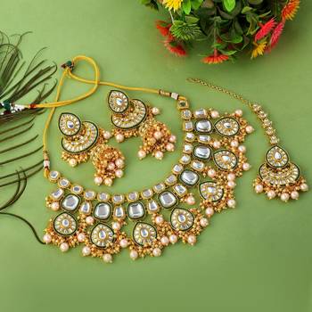 Designer gold color kundan necklace set for exclusive bridal look 2