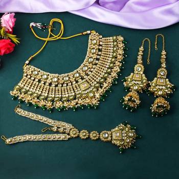 Traditional green color kundan necklace set with golden accents 1
