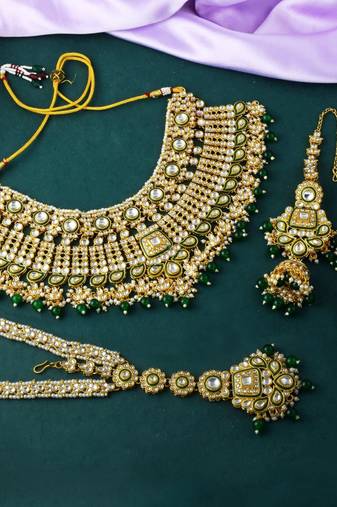 Traditional green color kundan necklace set with golden accents