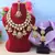 Glamorous maroon color kundan necklace set with gold highlights