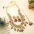Glamorous maroon color kundan necklace set with gold highlights