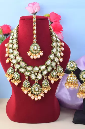 Ethnic gold color kundan necklace set with wedding stone details