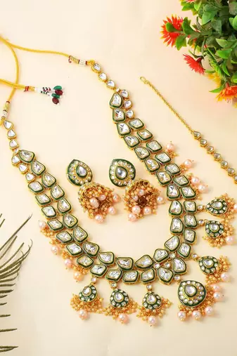 Ethnic gold color kundan necklace set with wedding stone details