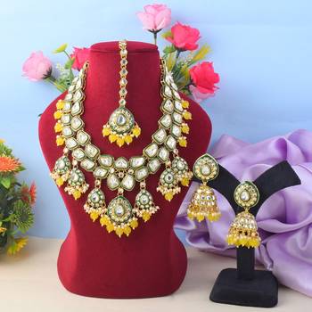 Vibrant yellow color kundan necklace set for cultural functions 1