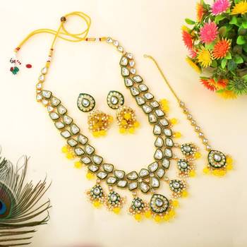 Vibrant yellow color kundan necklace set for cultural functions 2