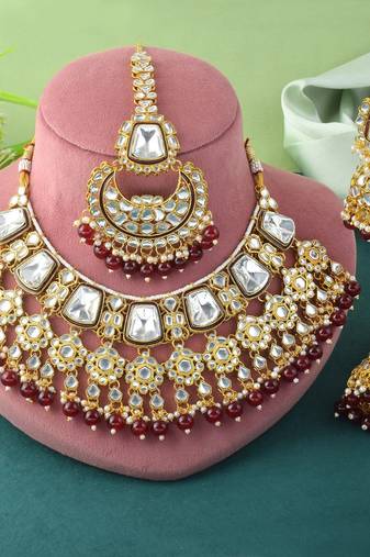Rich maroon color kundan necklace set for engagement ceremonies