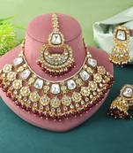 Rich maroon color kundan necklace set for engagement ceremonies