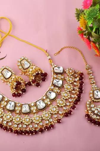 Rich maroon color kundan necklace set for engagement ceremonies