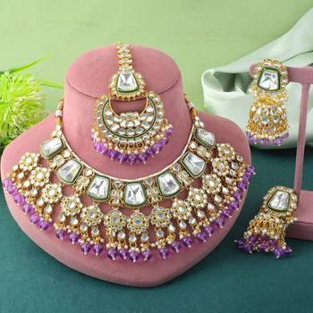 Royal purple color kundan necklace set with gold and gem detailing 1