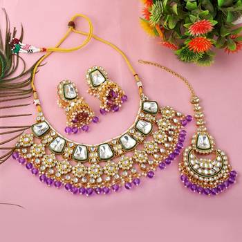 Royal purple color kundan necklace set with gold and gem detailing 2