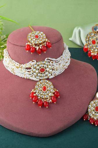 Vibrant red color choker kundan necklace set with classic embellishment