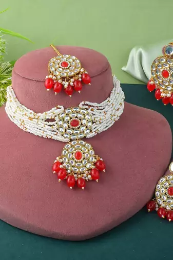 Vibrant red color choker kundan necklace set with classic embellishment