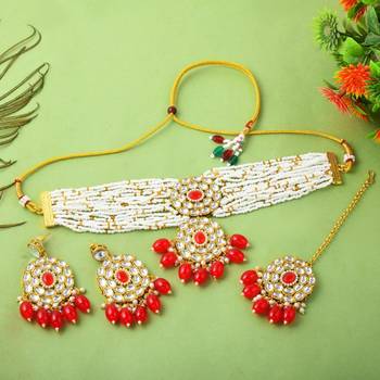 Vibrant red color choker kundan necklace set with classic embellishment 2