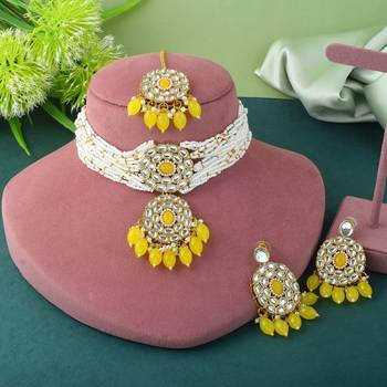 Yellow color choker kundan necklace set with traditional design accents 1