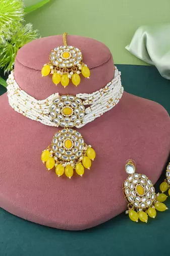 Yellow color choker kundan necklace set with traditional design accents