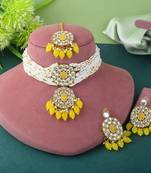Yellow color choker kundan necklace set with traditional design accents