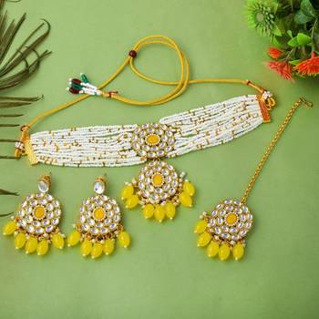 Yellow color choker kundan necklace set with traditional design accents 2
