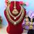 Rich maroon & green color kundan necklace set for royal occasions