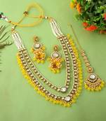 Bright yellow color kundan necklace set for traditional daytime celebrations