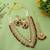 Deep maroon color kundan necklace set with wedding stone highlights