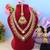 Deep maroon color kundan necklace set with wedding stone highlights