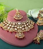 Beautiful maroon color kundan necklace set with elegant gold accents